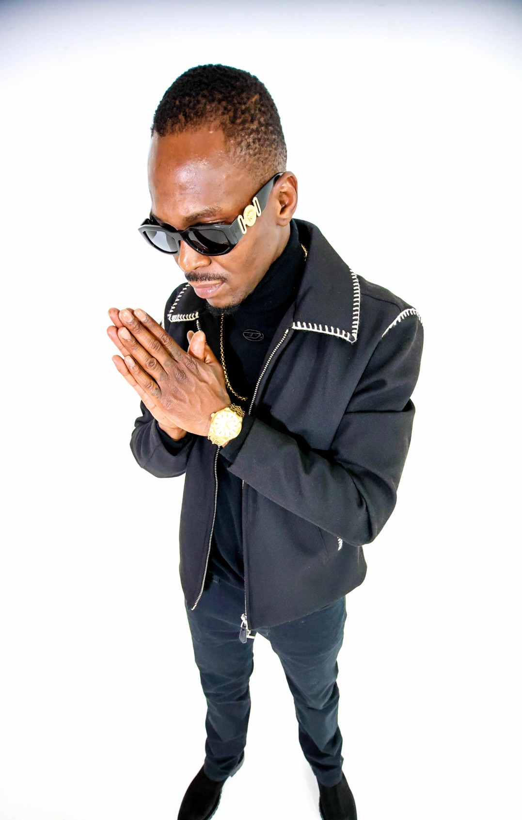 El Presi prayer hands portrait